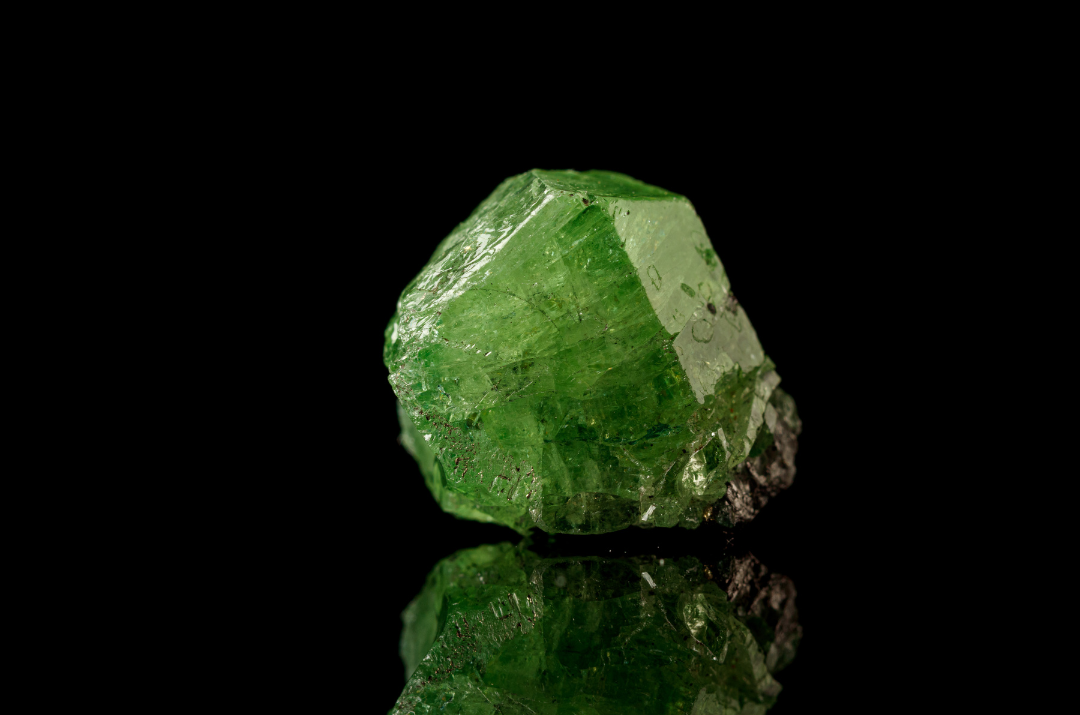 Demantoid Garnet Blog Post What is demantoid garnet? Green gemstone with fiery brilliance.