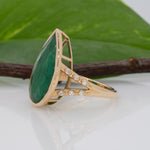 14K yellow gold Zambian emerald pear ring with diamond accents
