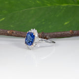 14K white and rose gold tanzanite ring with diamond accents