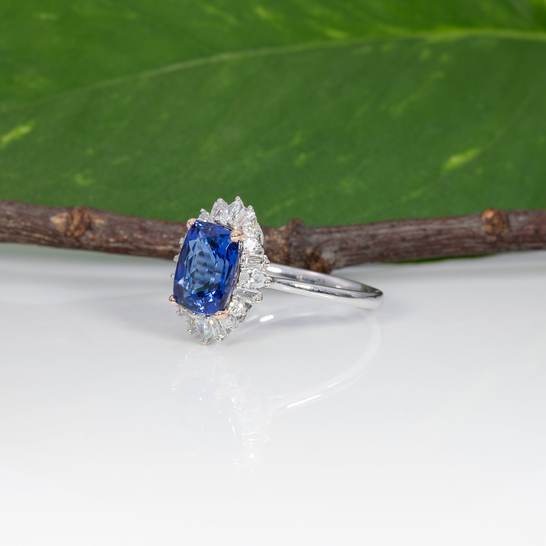 14K white and rose gold tanzanite ring with diamond accents