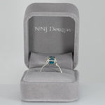 14K white gold Cambodian blue zircon cushion ring with diamond accents