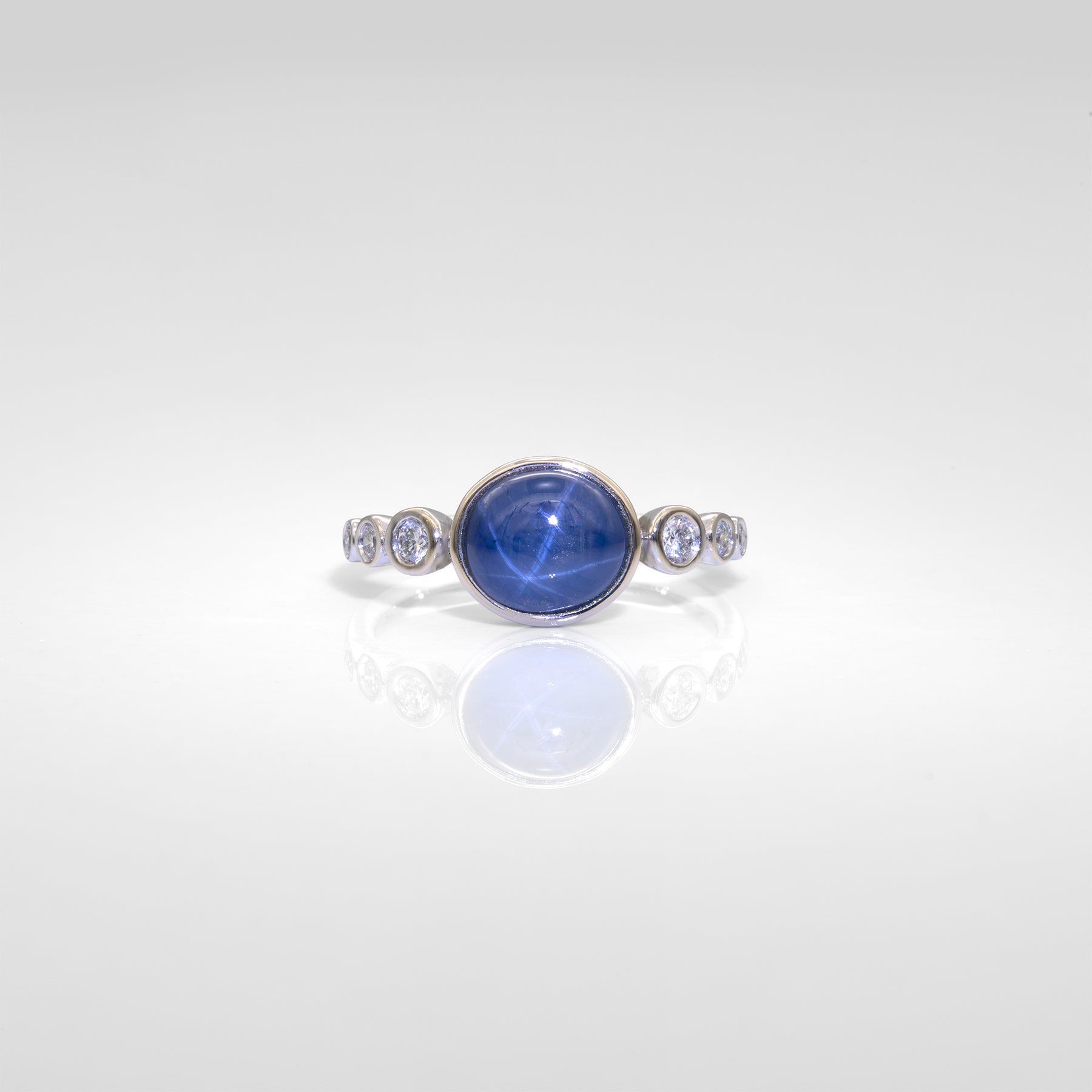 14K white gold blue star sapphire cabochon ring with diamonds