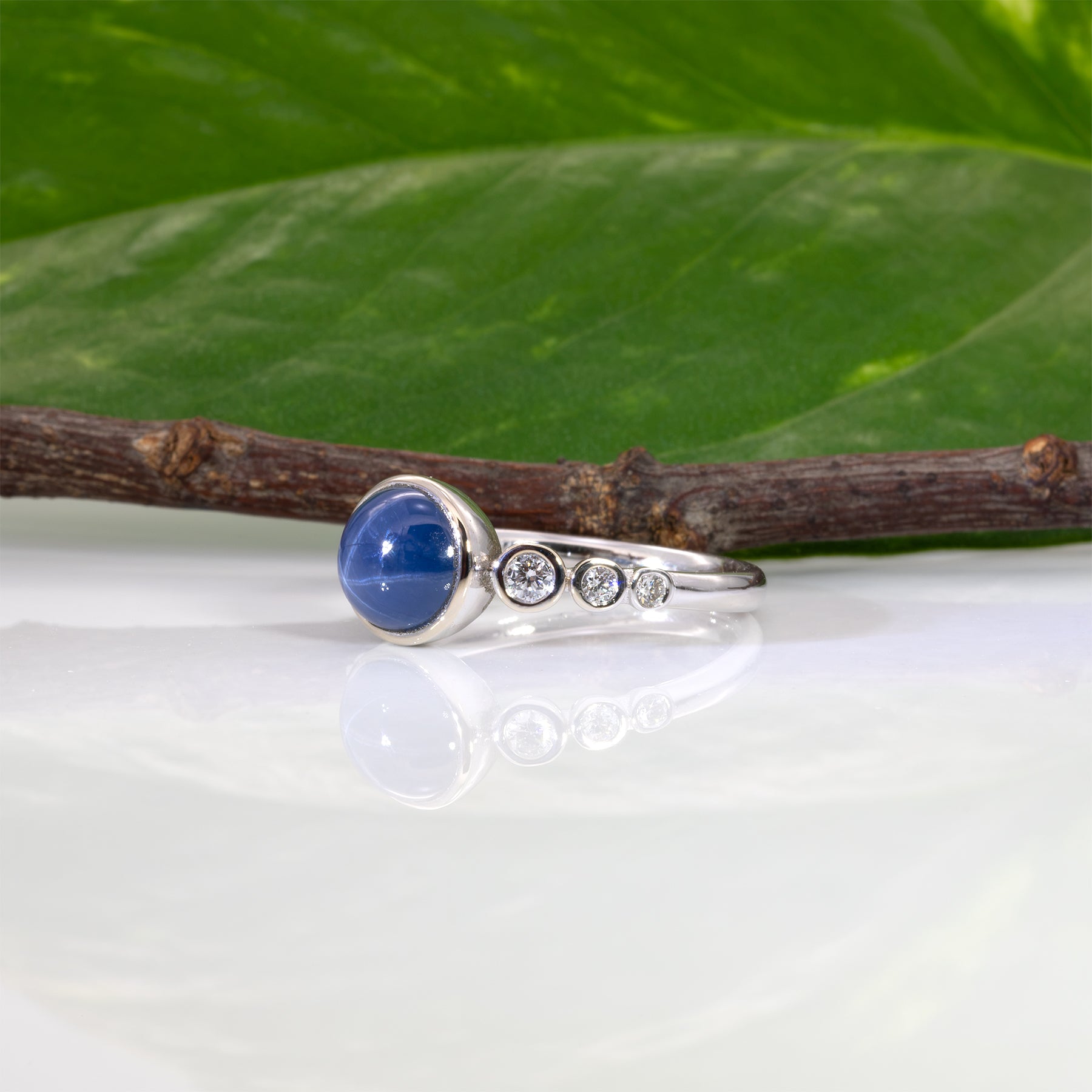 14K white gold blue star sapphire cabochon ring with diamonds
