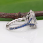 platinum lab grown diamond ring with blue sapphire accents
