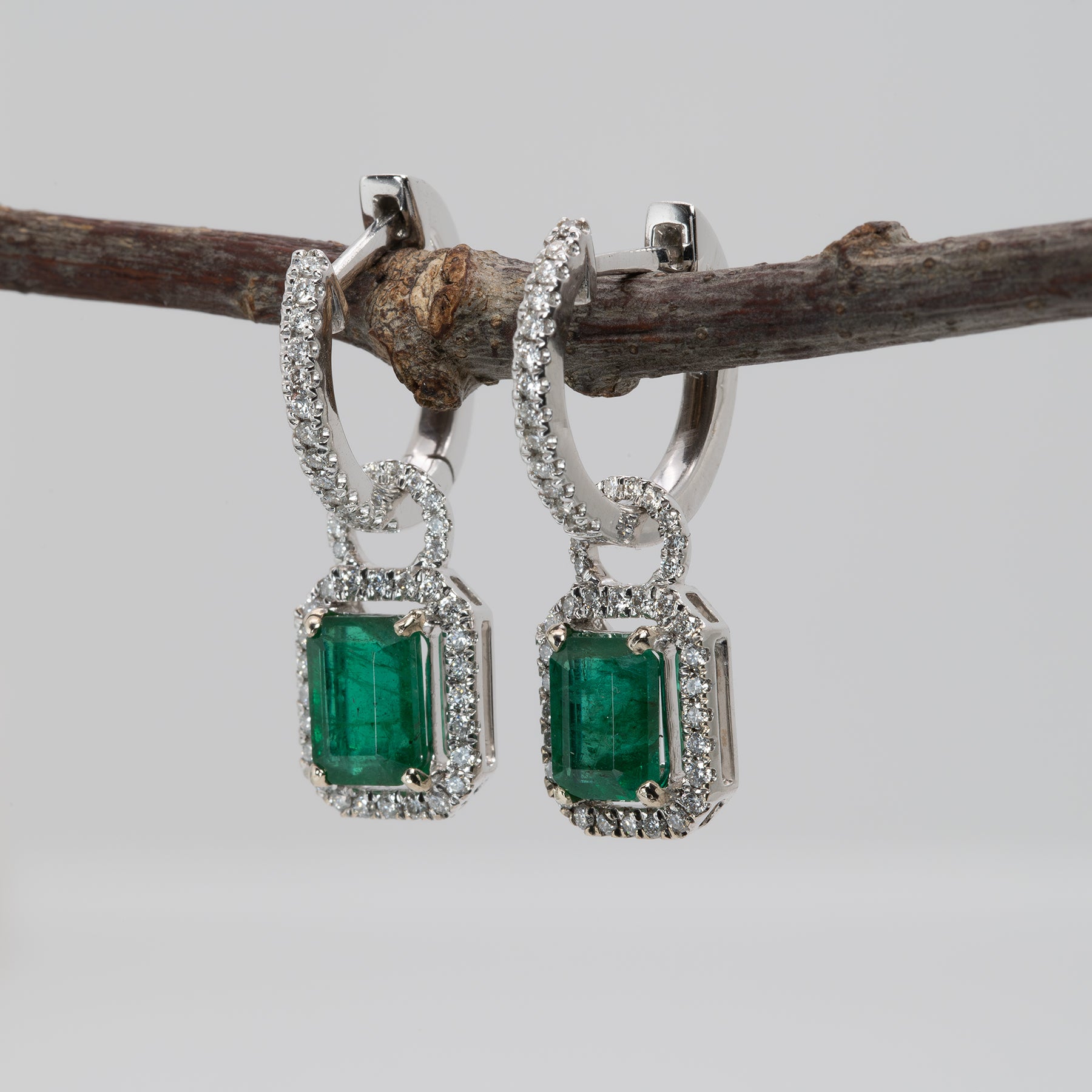 14K white gold Zambian emerald earrings with diamond halos