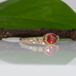 14K yellow gold padparadscha sapphire oval ring with diamond accents