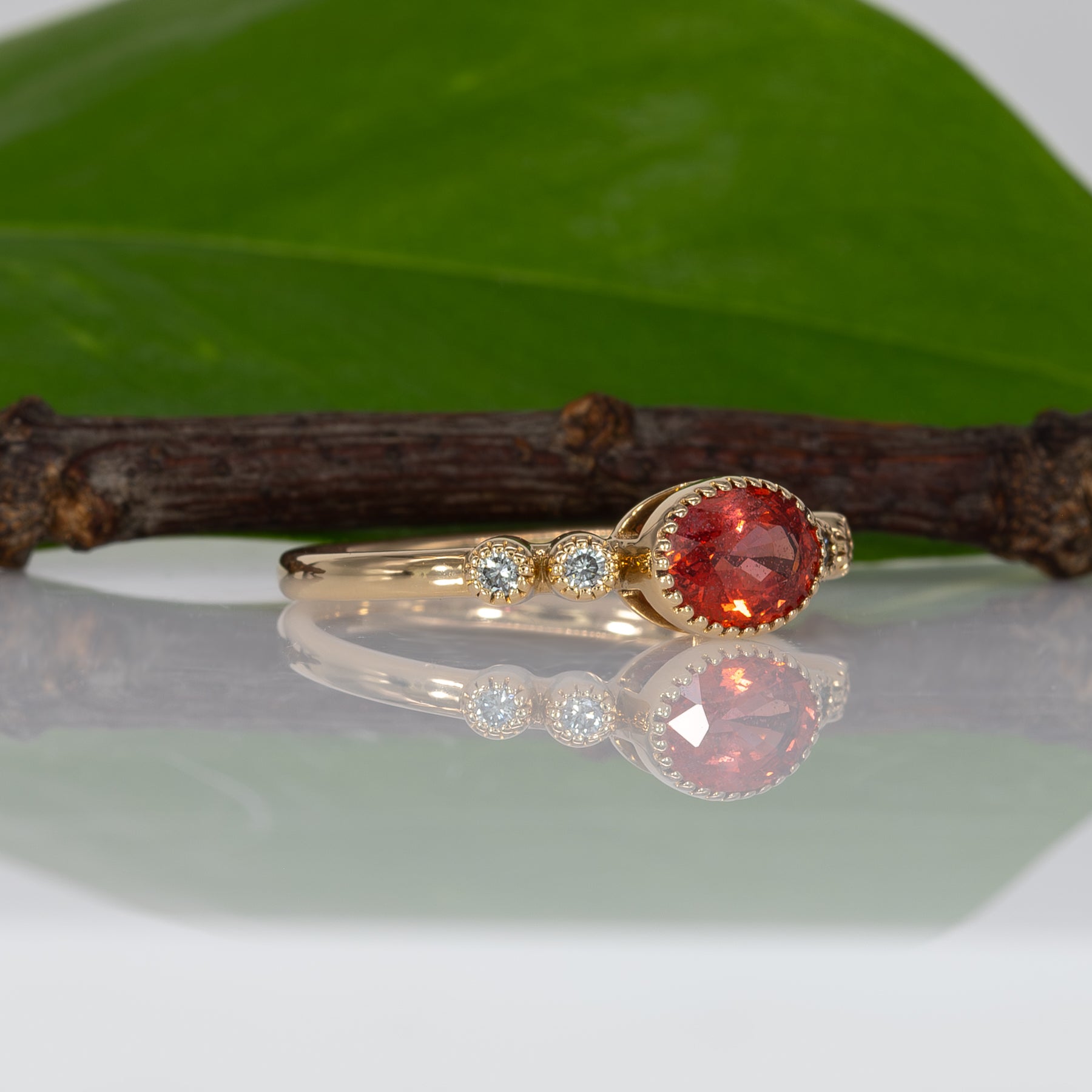 14K yellow gold padparadscha sapphire oval ring with diamond accents