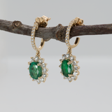 Emerald Stud Earrings in 14K Yellow Gold | Diamond Accents | Oval Cut | 7x5mm | May Birthstone