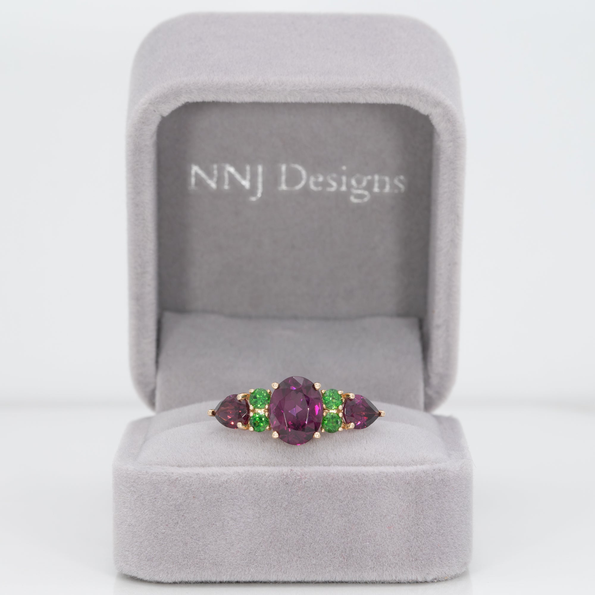 14K yellow gold purple garnet ring