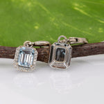 14K white gold aquamarine emerald-cut stud earrings with diamond halo