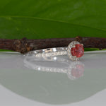 14K white gold padparadscha sapphire oval ring with diamond halo