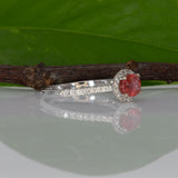 14K white gold padparadscha sapphire oval ring with diamond halo