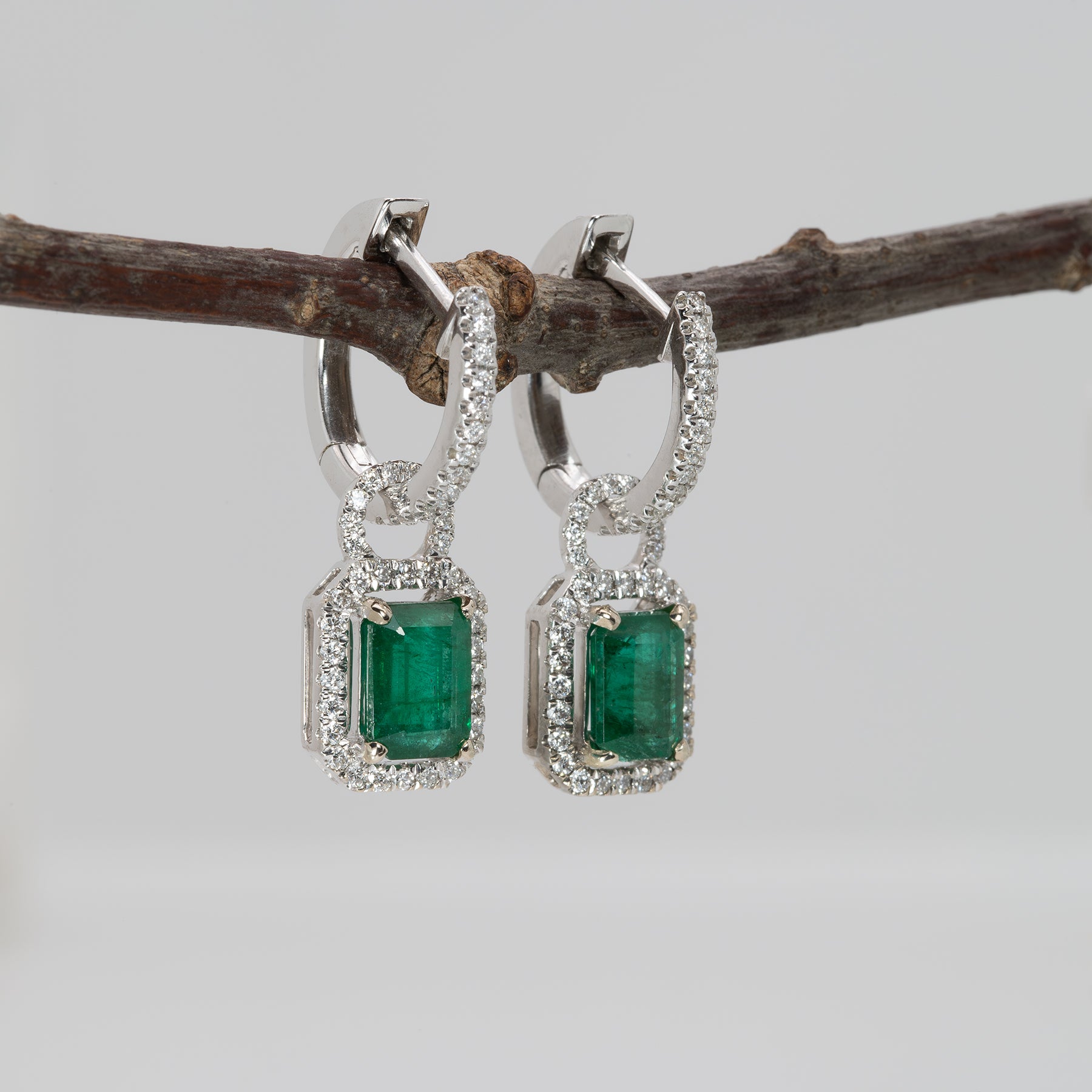 14K white gold Zambian emerald earrings with diamond halos