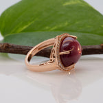 14K rose gold star ruby cabochon ring with diamond halo