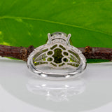 14K white gold peridot oval ring with diamond halo