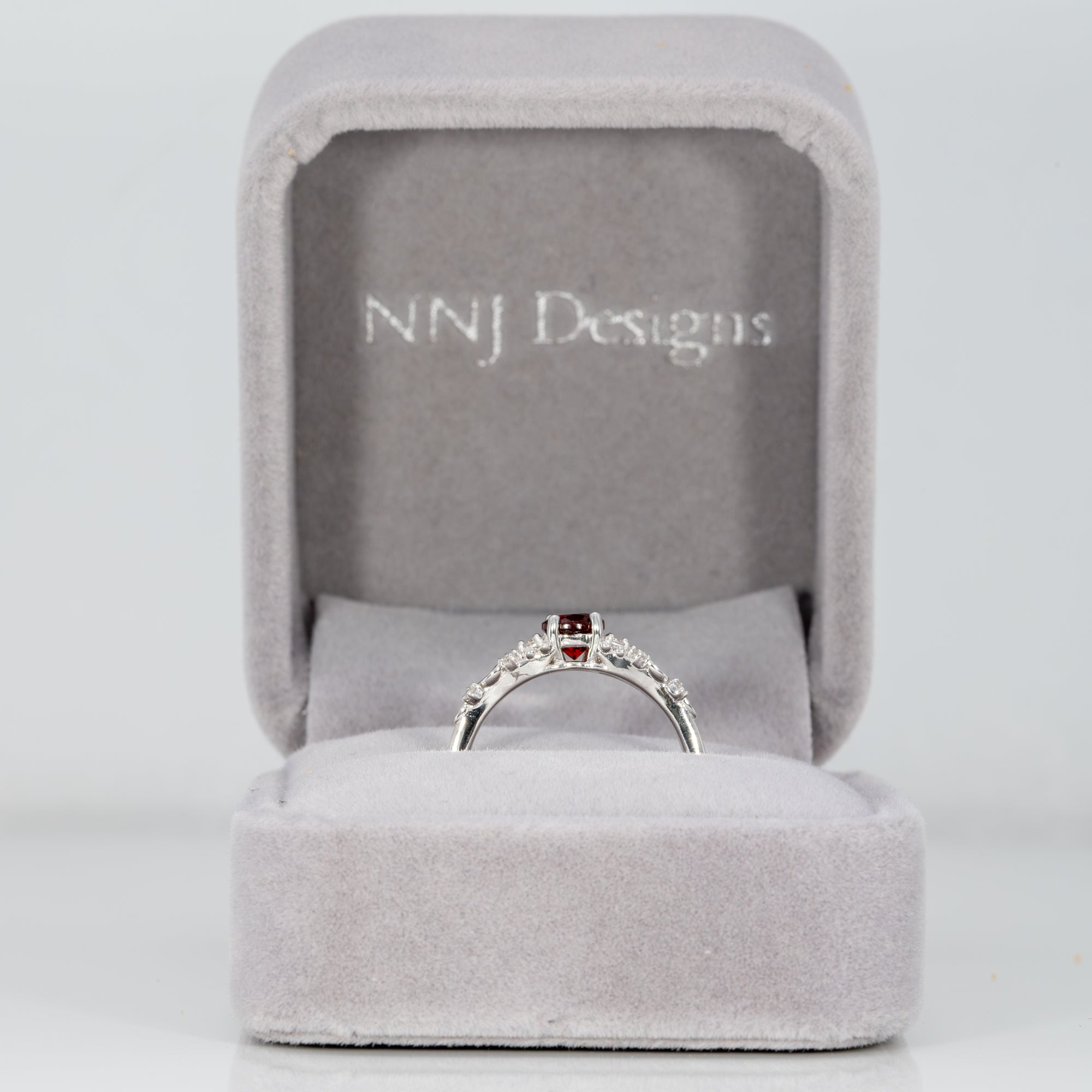 14K white gold red spinel ring with diamond accents