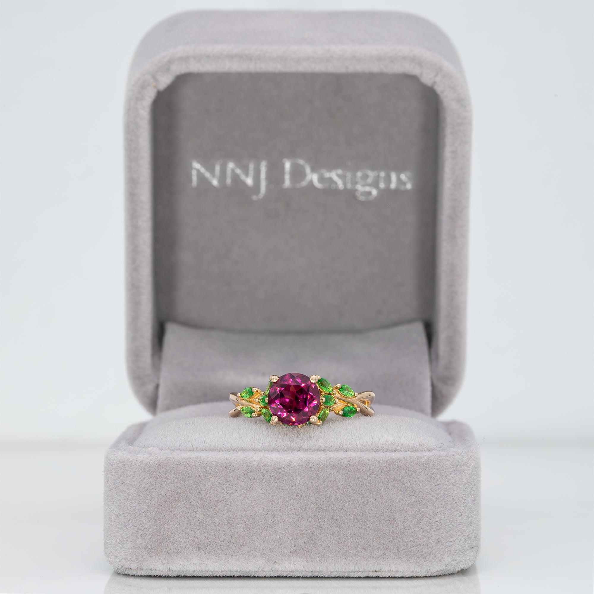 14K yellow gold purple garnet ring with tsavorite accents