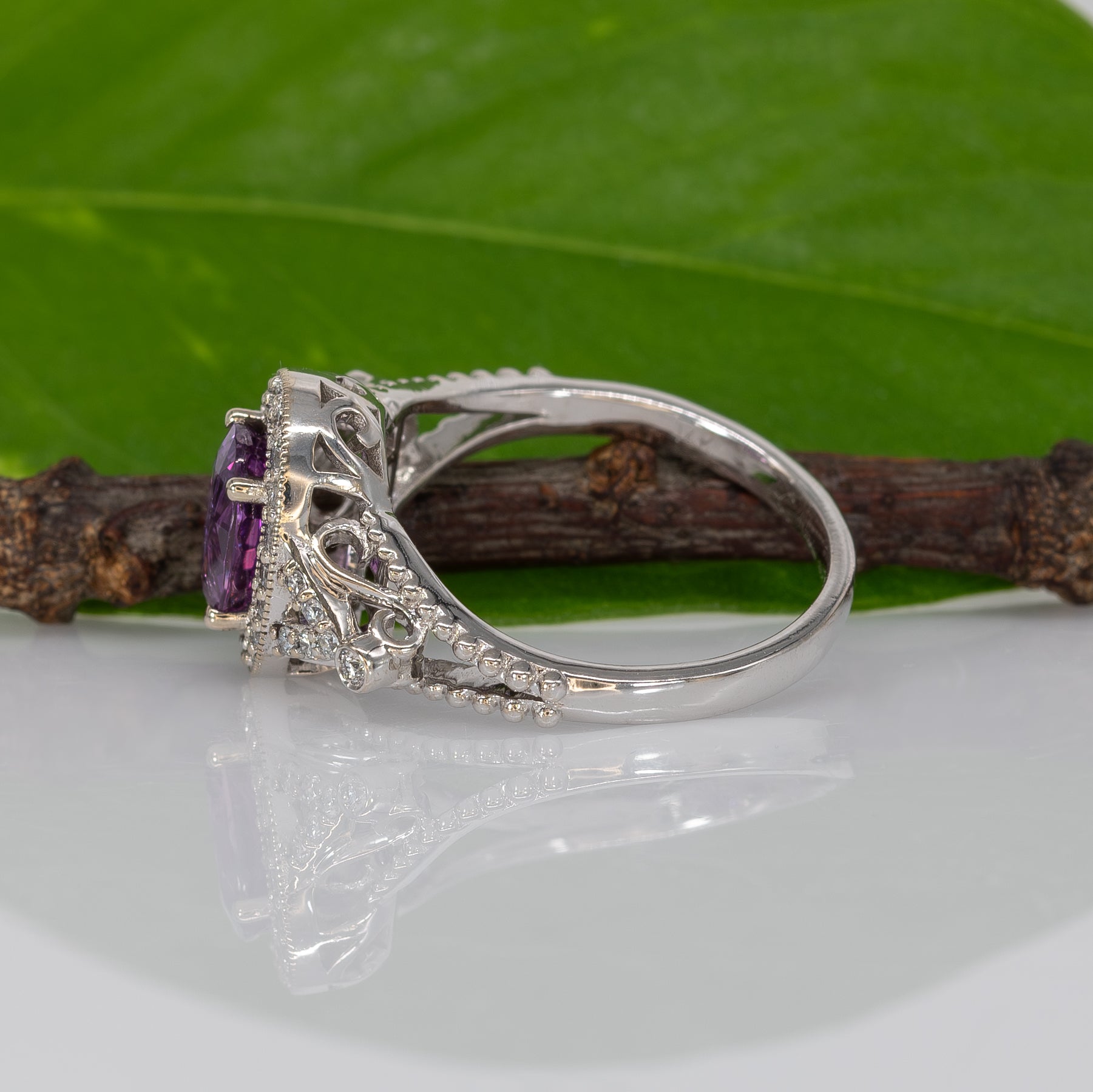 14K white gold pink sapphire oval ring with diamond halo