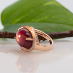 14K rose gold star ruby cabochon ring with diamond halo