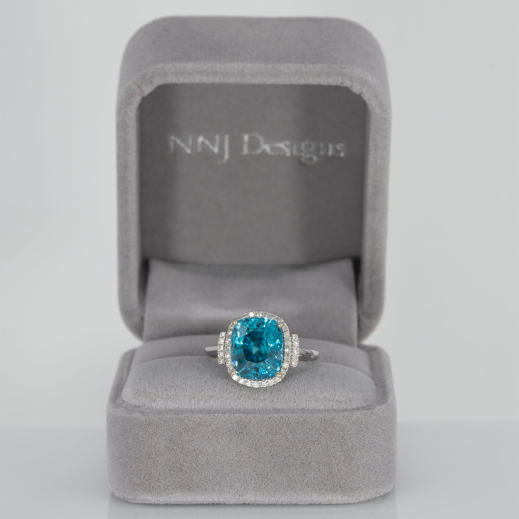 14K white gold Cambodian blue zircon cushion ring with diamond halo