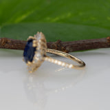 14K yellow gold GIA Ceylon sapphire cushion ring with diamond halo