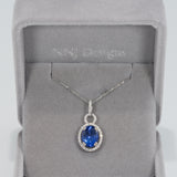 14K white gold tanzanite pendant