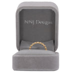 14K yellow gold band with round Zambian emerald accents