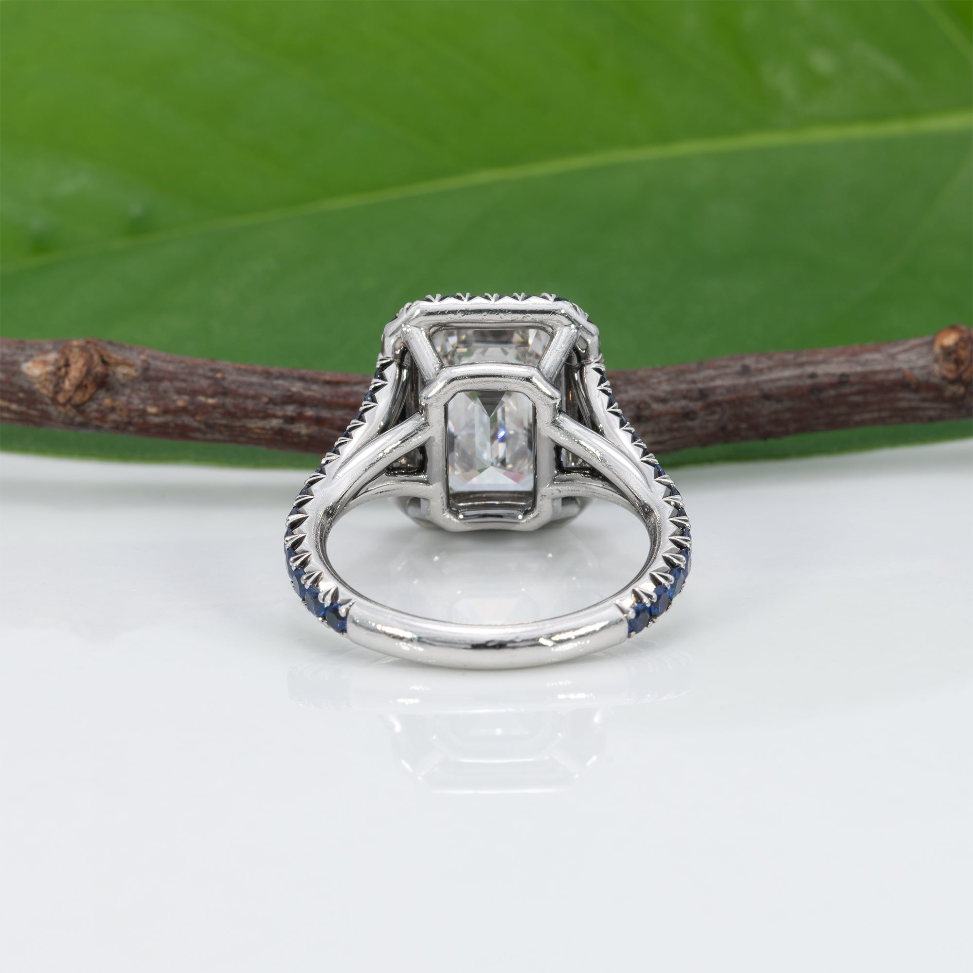 platinum lab grown diamond ring with blue sapphire accents