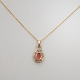 14K yellow gold padparadscha sapphire pendant