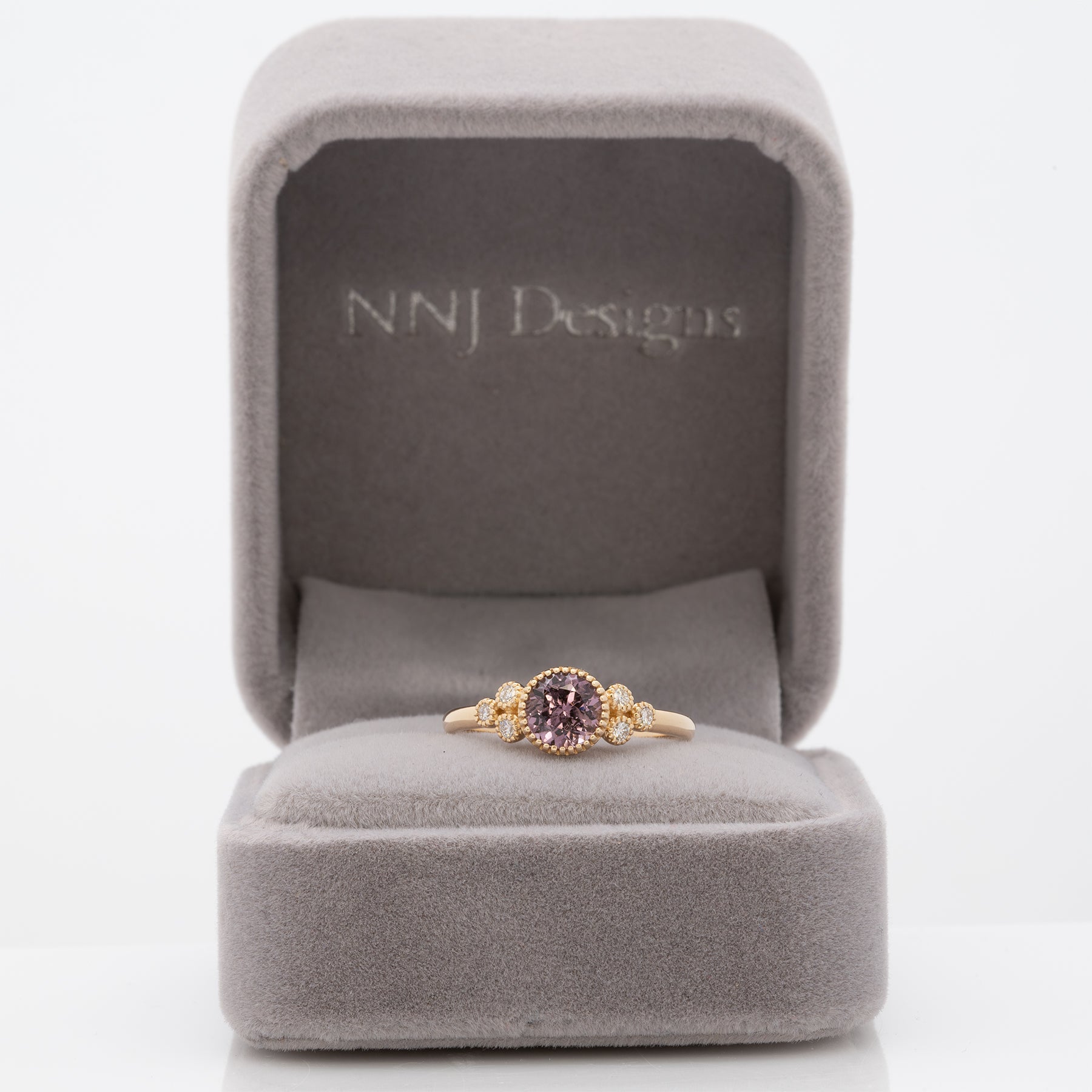 14K yellow gold purple spinel round ring with diamond accents