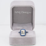 platinum lab grown diamond ring with blue sapphire accents