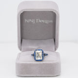 platinum lab grown diamond ring with blue sapphire accents