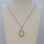 14K white & yellow gold ethiopian opal pendant with diamond accents