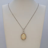 14K white & yellow gold ethiopian opal pendant with diamond accents
