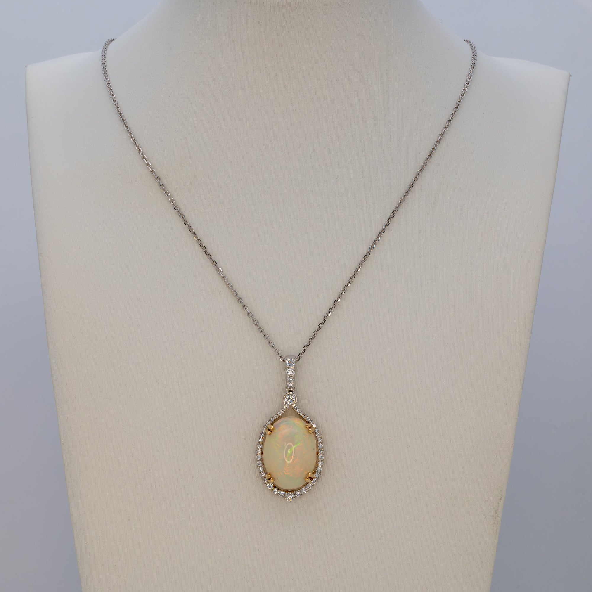 14K white & yellow gold ethiopian opal pendant with diamond accents
