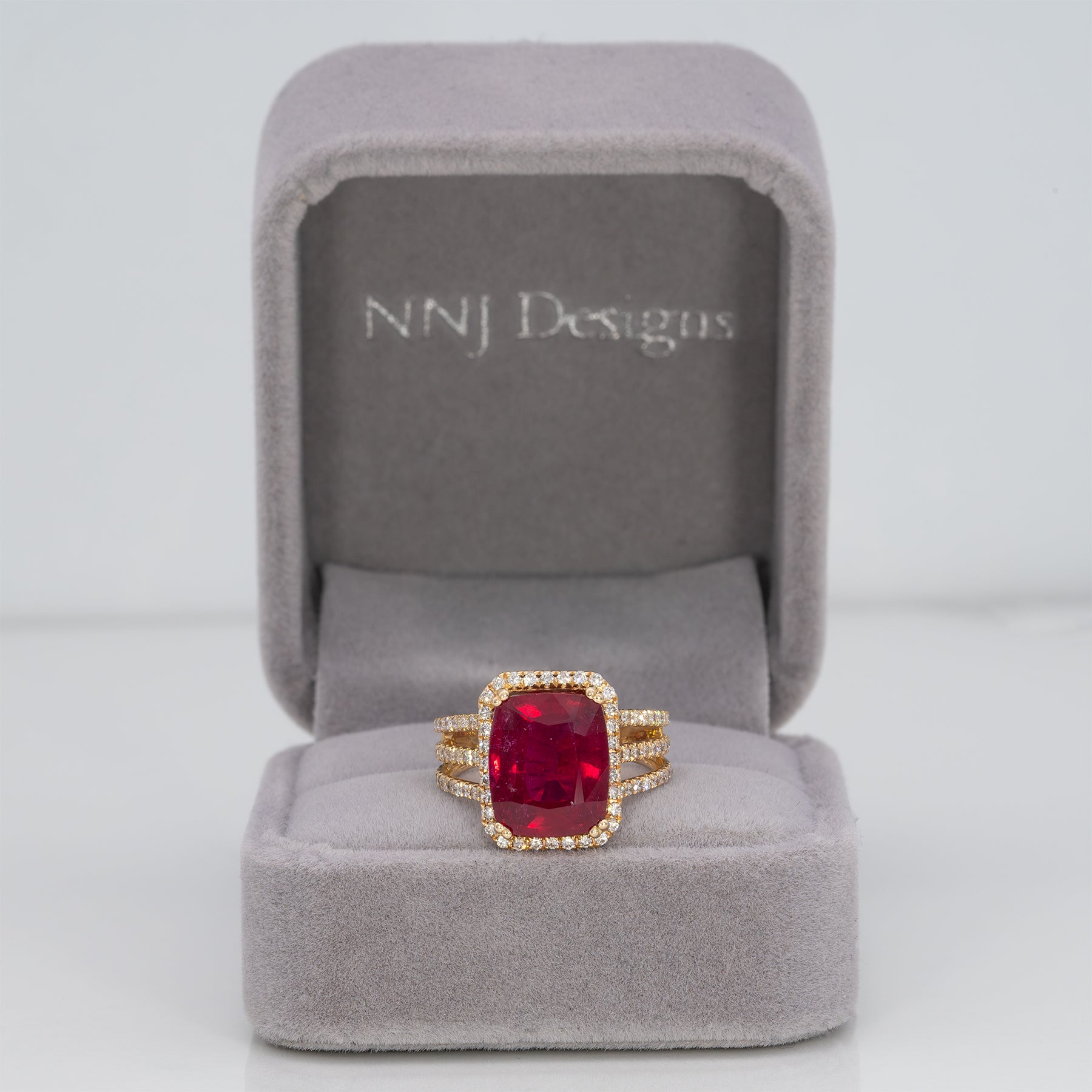 14K yellow gold Madagascar ruby ring with diamond halo