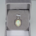 14K white & yellow gold ethiopian opal pendant with diamond accents