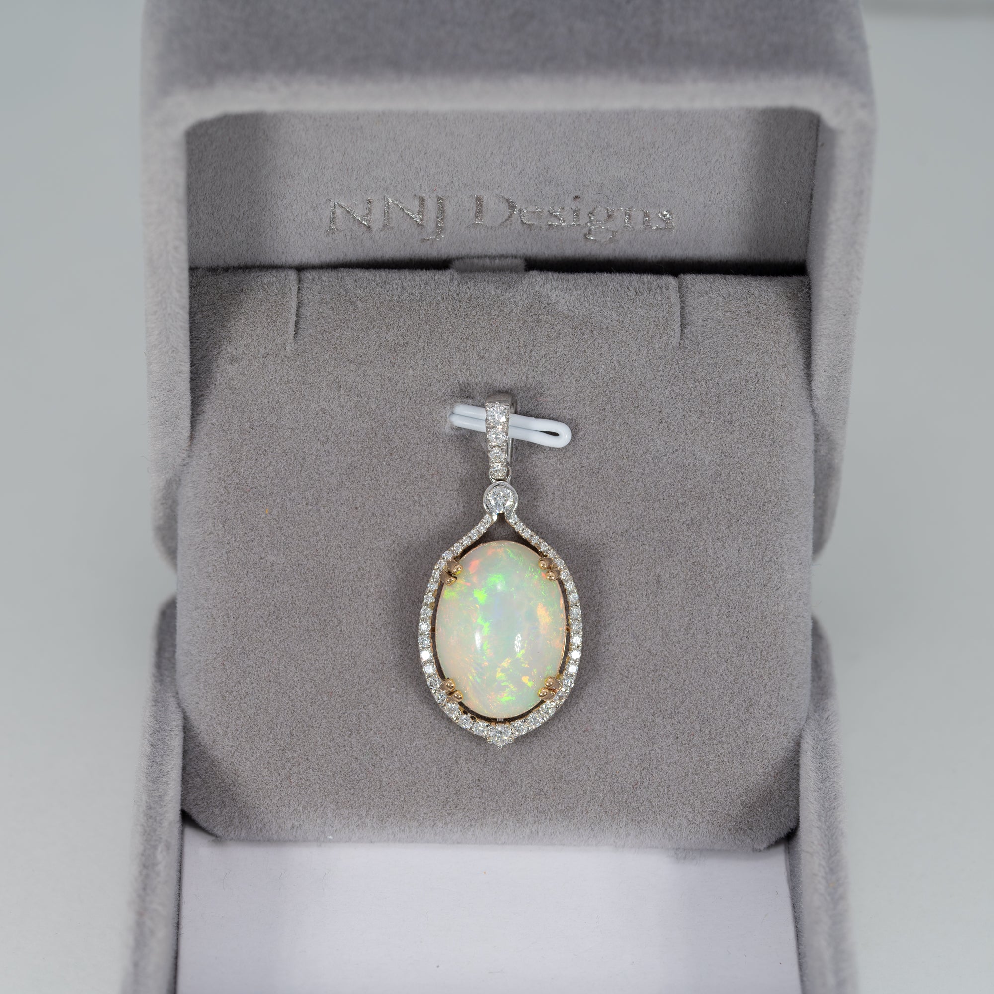14K white & yellow gold ethiopian opal pendant with diamond accents
