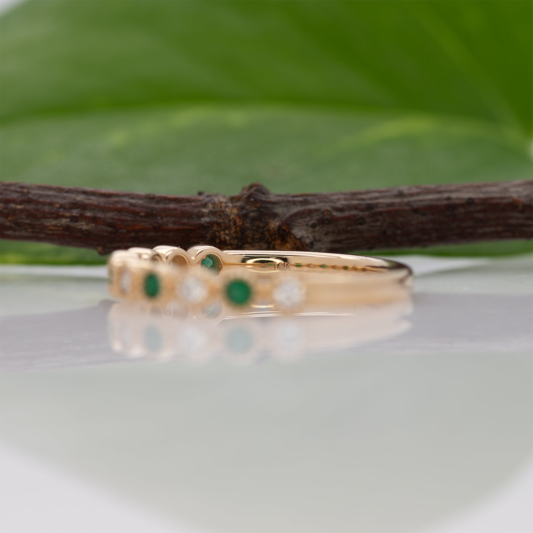 14K yellow gold Zambian emerald band ring with diamond accents