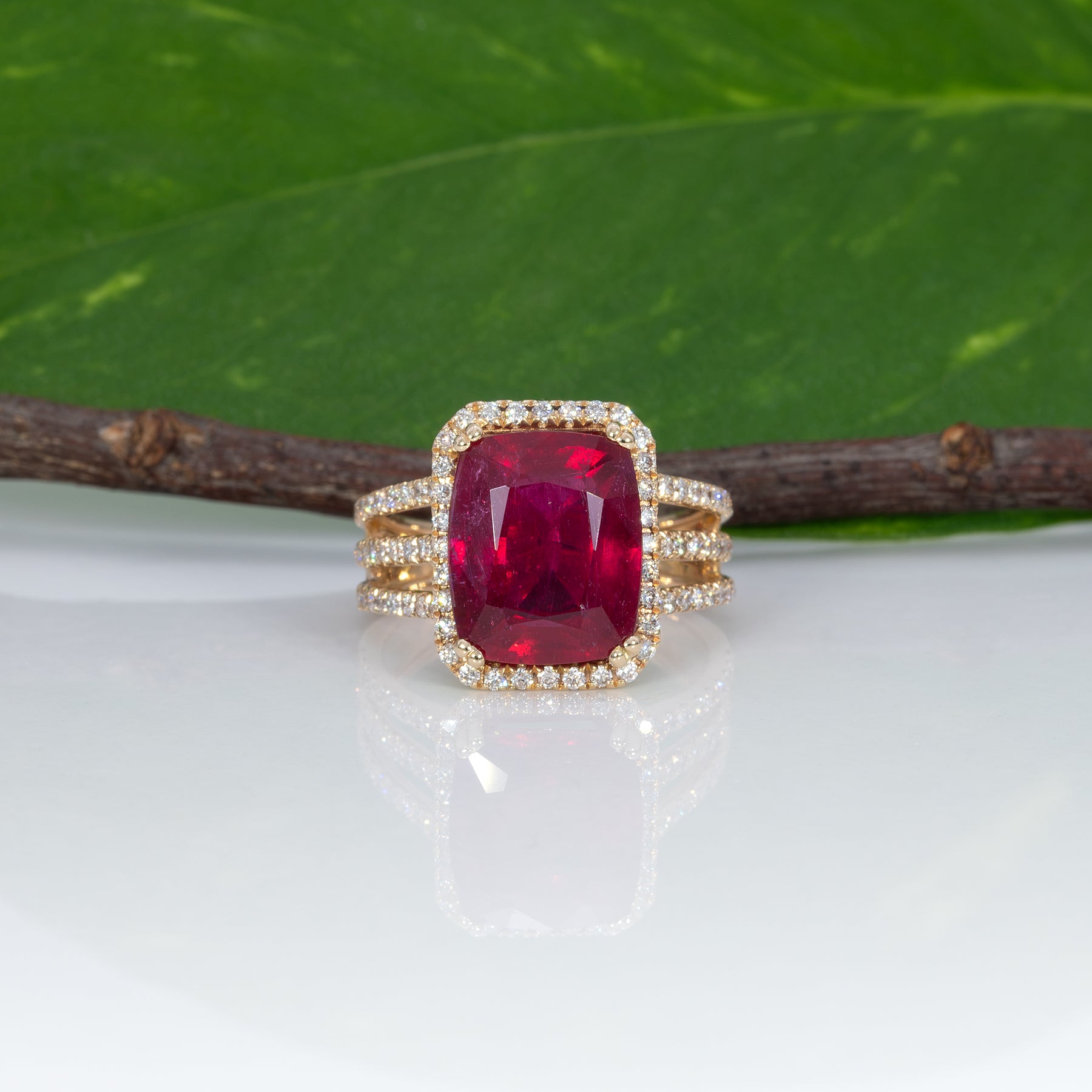 14K yellow gold Madagascar ruby ring with diamond halo