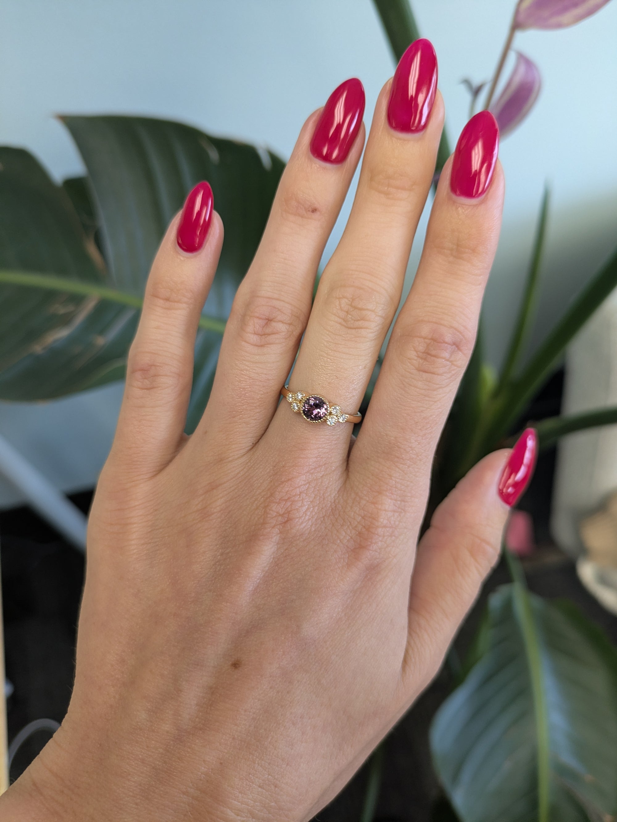 14K yellow gold bezel-set purple spinel ring with diamond accents