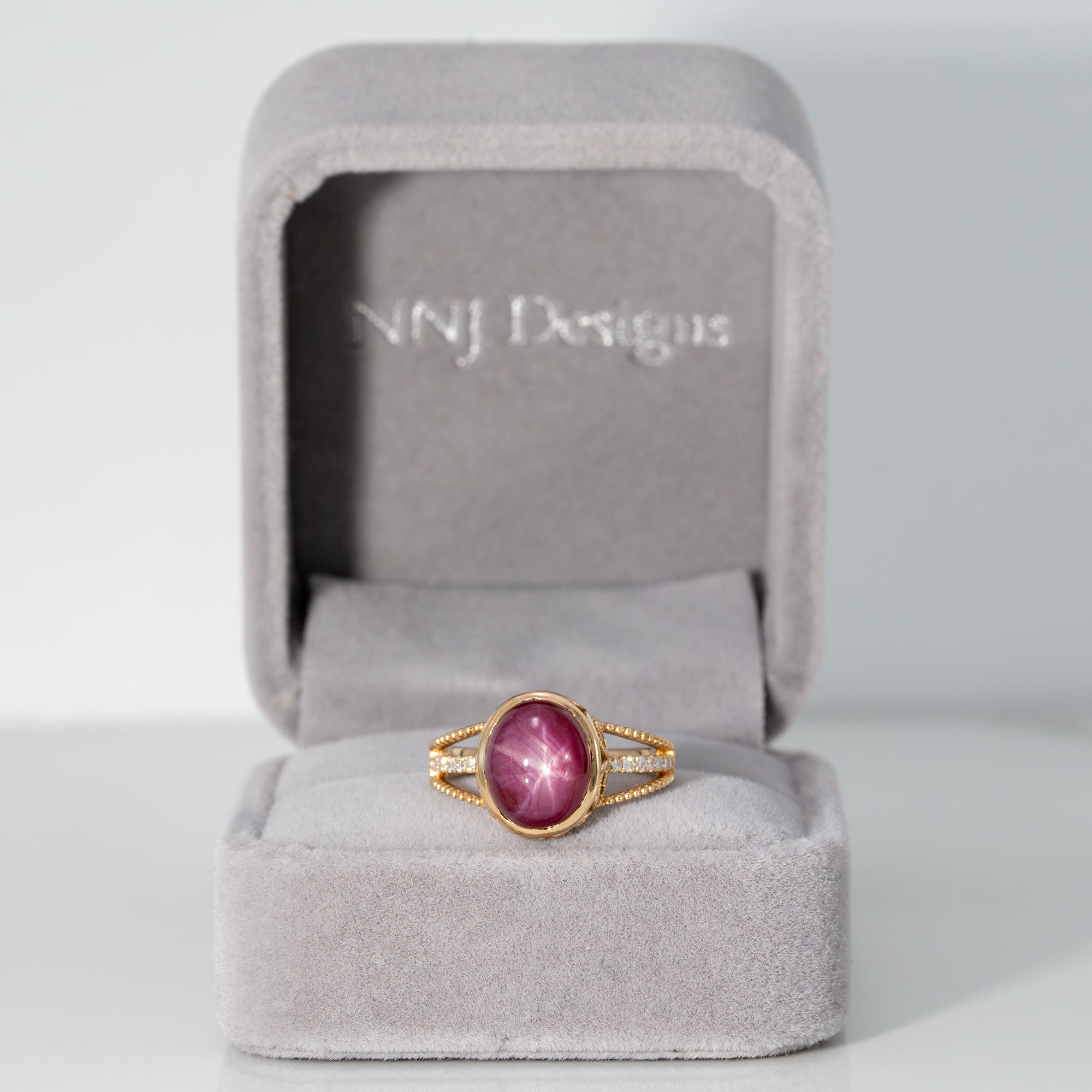 14K yellow gold star ruby cabochon ring with diamond accents