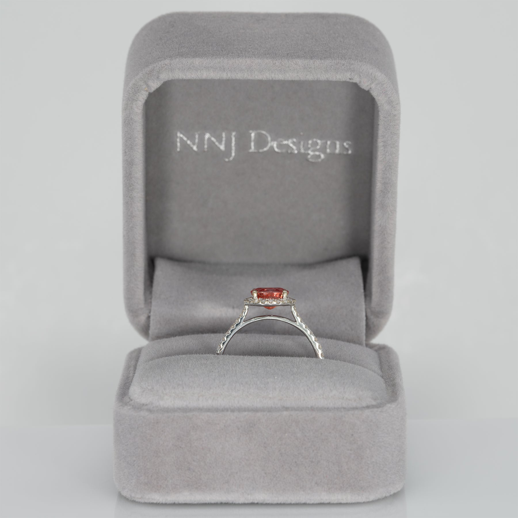 14K white gold padparadscha sapphire oval ring with diamond halo