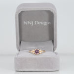 14K yellow gold bezel-set purple spinel ring with diamond accents