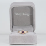 14K yellow gold bezel-set purple spinel ring with diamond accents