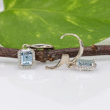 14K white gold aquamarine emerald-cut stud earrings with diamond halo