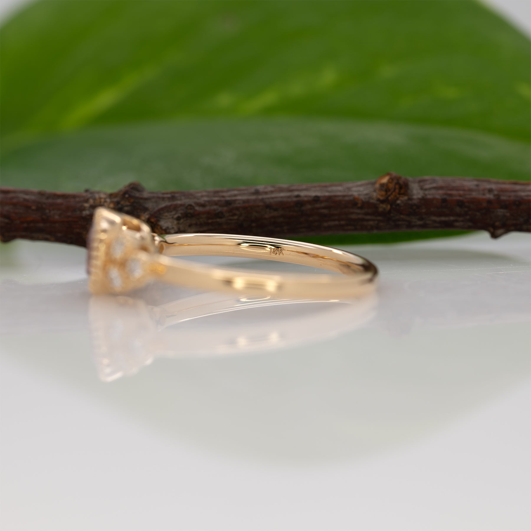 14K yellow gold purple spinel round ring with diamond accents