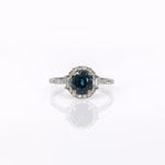 14K white gold teal sapphire oval ring with diamond halo