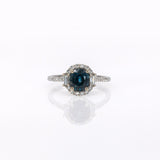 14K white gold teal sapphire oval ring with diamond halo