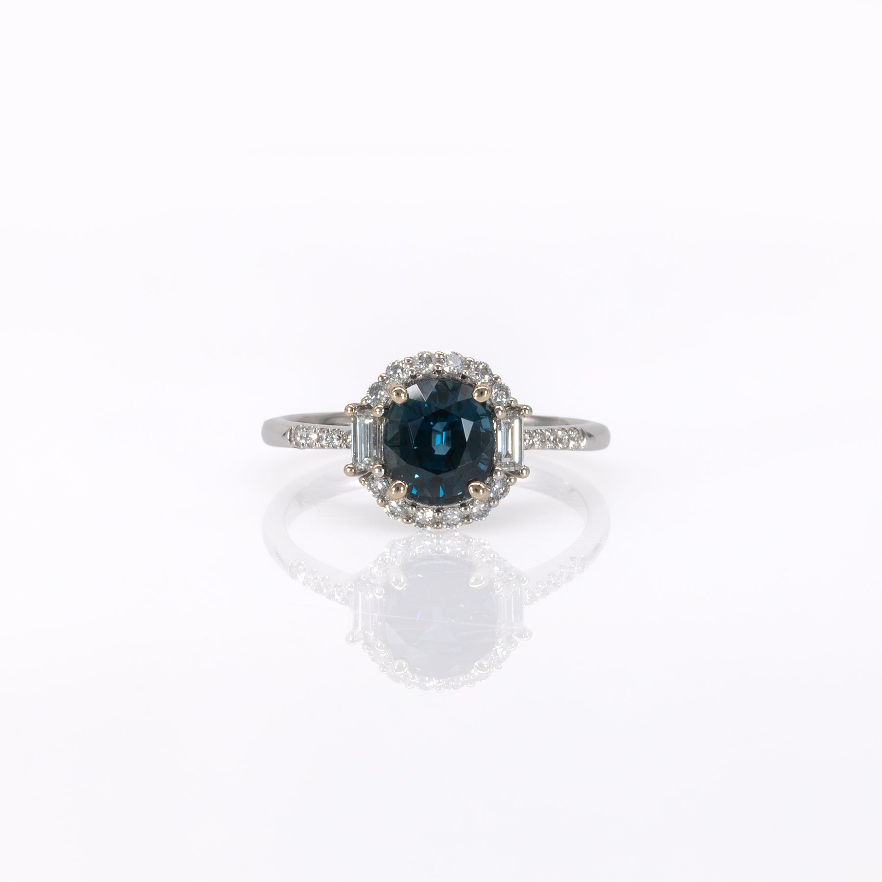 14K white gold teal sapphire oval ring with diamond halo